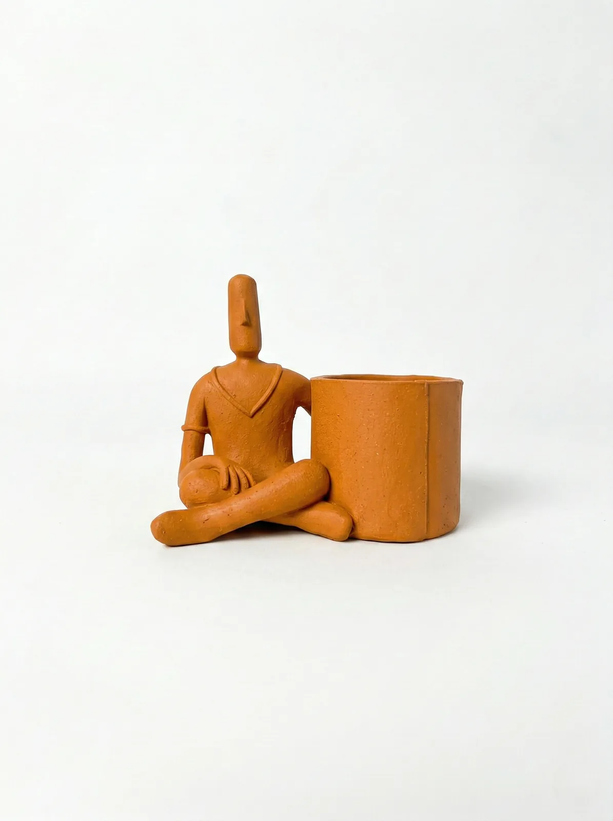 Escultura Homem Sentado com Cachepô